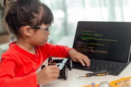Person at standing desk working on laptop
